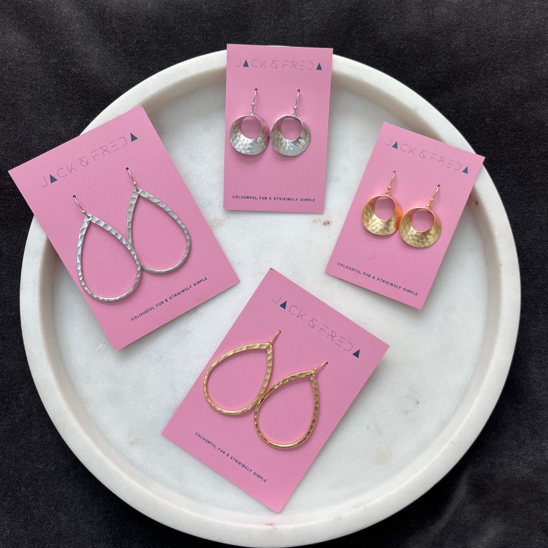 Hammered Tear Drop earrings and Hammered Curl earrings in silver and gold