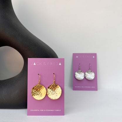 Hammered coin earrings in gold and silver