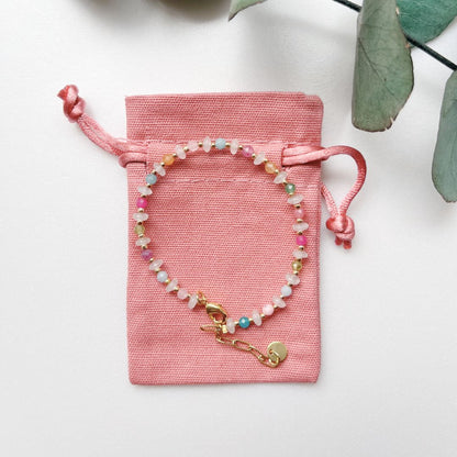 Edie gemstone bracelet on coral cotton pouch